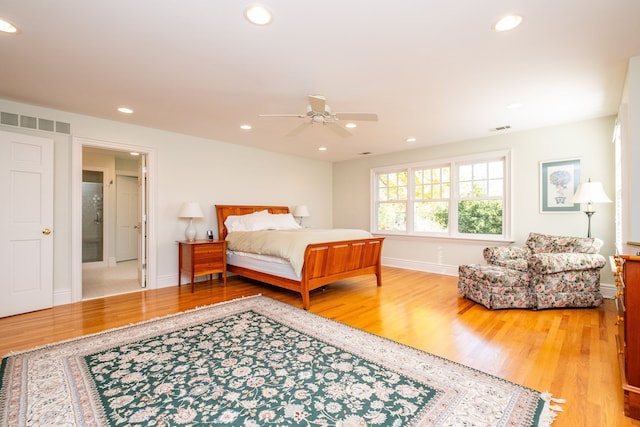 bedroom featuring baseboards, visible vents, wood finished floors, and recessed lighting