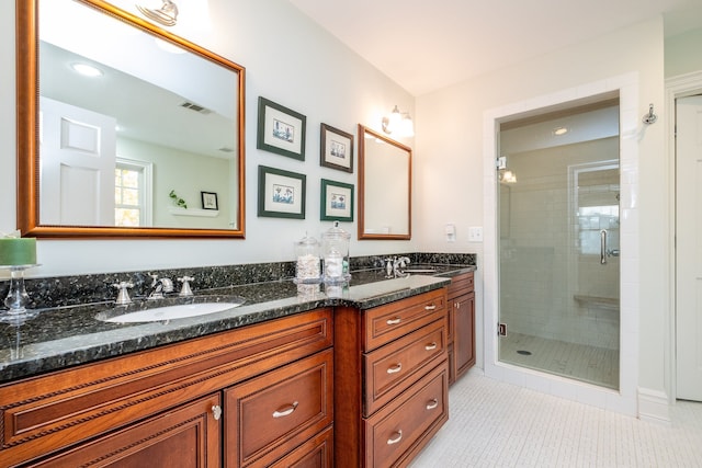 full bathroom with a shower stall, visible vents, a sink, and tile patterned floors