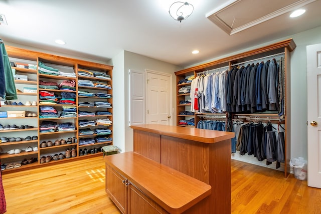 walk in closet featuring light wood-style flooring and visible vents