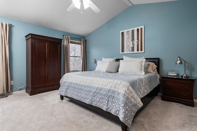 bedroom with lofted ceiling, light colored carpet, and ceiling fan