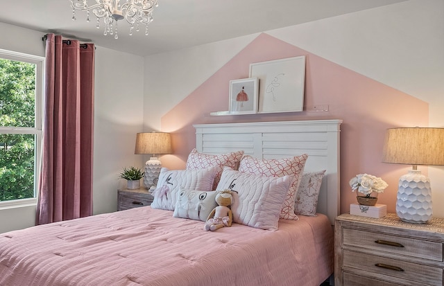 bedroom with a chandelier and vaulted ceiling