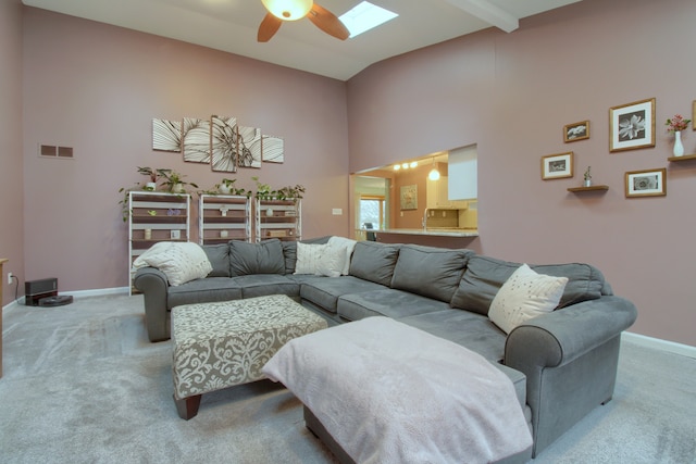 living area with carpet, visible vents, and baseboards