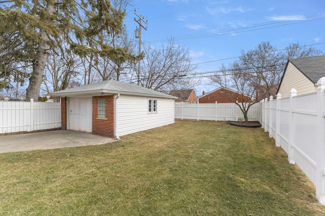 view of yard featuring a patio area, a fenced backyard, and an outdoor structure