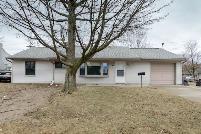 single story home with an attached garage, concrete driveway, and roof with shingles