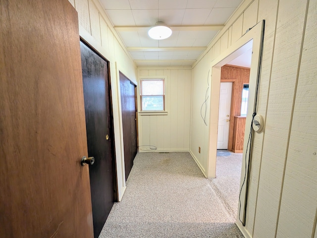 corridor with light carpet