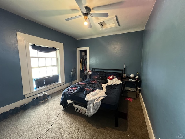 bedroom with carpet floors, a closet, attic access, and baseboards