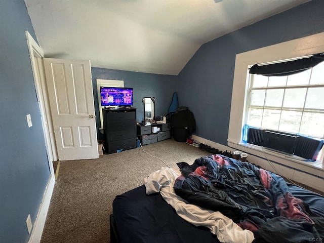 bedroom featuring lofted ceiling, carpet, and baseboards