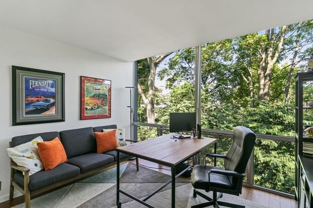 office featuring wood finished floors and floor to ceiling windows