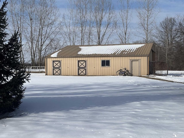 view of snow covered garage