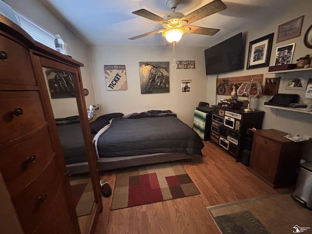 bedroom featuring ceiling fan and wood finished floors