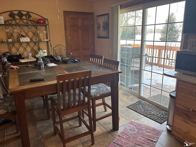 dining room with visible vents and tile patterned floors