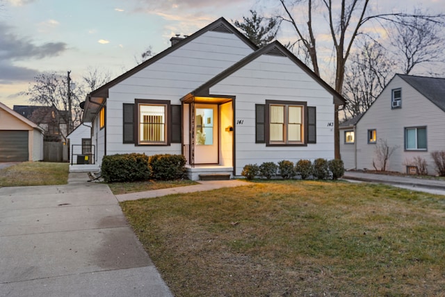 bungalow-style home featuring a yard