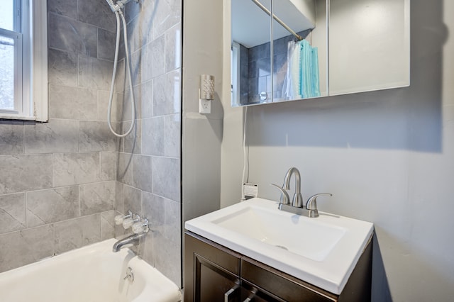 bathroom with shower / bath combination with curtain and vanity