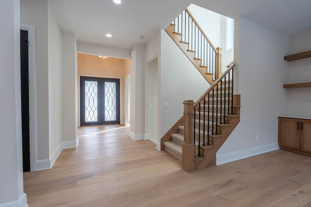 foyer entrance with recessed lighting, stairs, baseboards, and wood finished floors