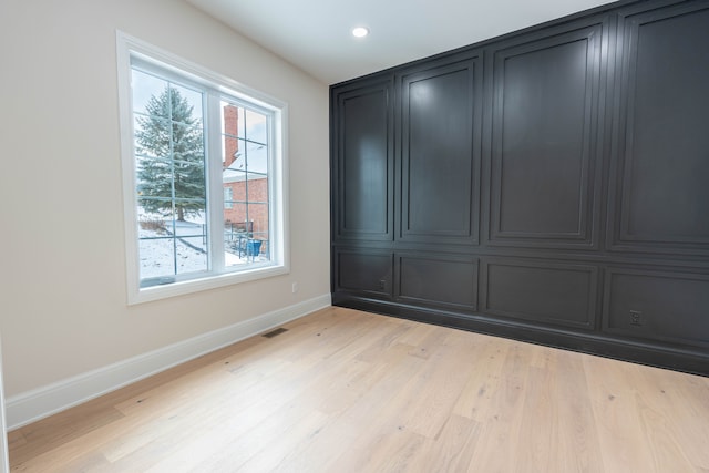 interior space with recessed lighting, light wood-style floors, visible vents, and baseboards