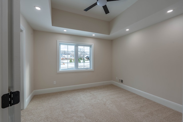 carpeted spare room with recessed lighting, visible vents, baseboards, and a ceiling fan