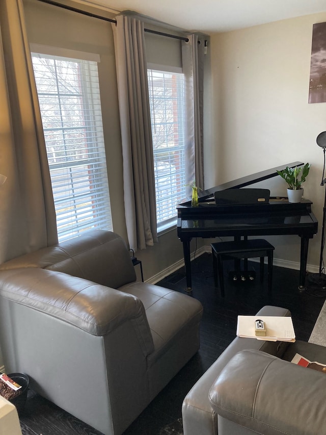 living room with baseboards and wood finished floors