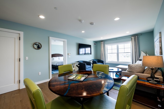 dining room featuring recessed lighting, baseboards, and wood finished floors