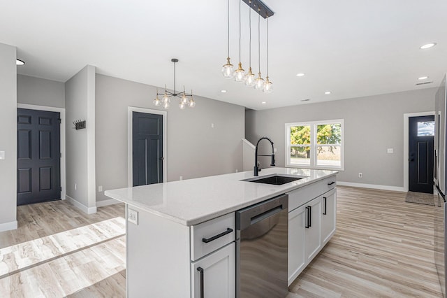 kitchen with recessed lighting, a sink, light wood-type flooring, dishwasher, and baseboards