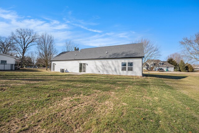 rear view of house with a lawn