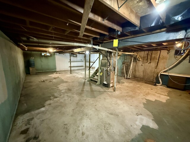 unfinished basement with heating unit