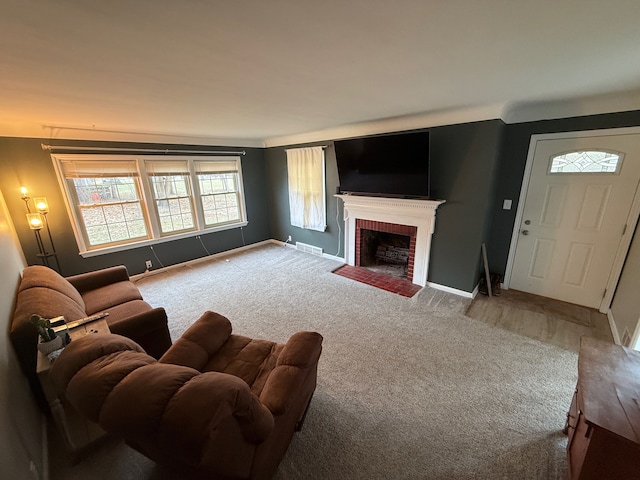 carpeted living room with visible vents, a fireplace, and baseboards