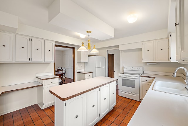 kitchen featuring a center island, pendant lighting, white cabinetry, a sink, and white appliances