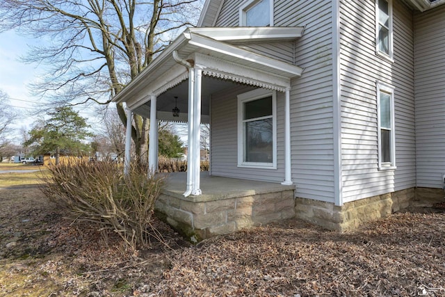 view of side of property with a porch