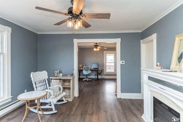 living area with a fireplace, a baseboard heating unit, dark wood-type flooring, ornamental molding, and baseboards