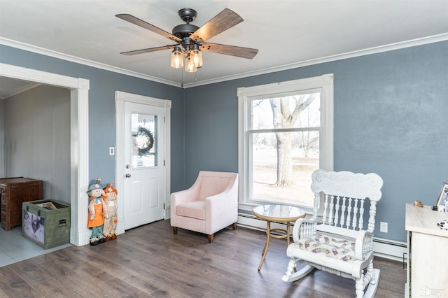 living area featuring ceiling fan, wood finished floors, and crown molding