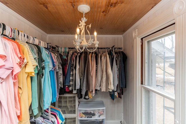 spacious closet with a notable chandelier