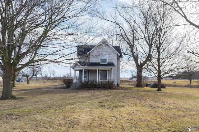 view of front of property featuring a front lawn and a porch