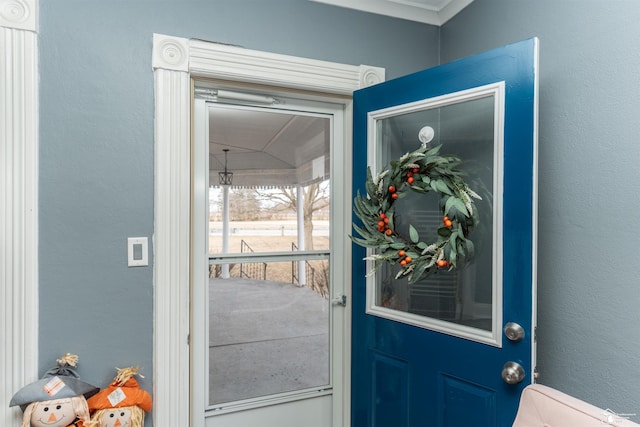 property entrance with stucco siding