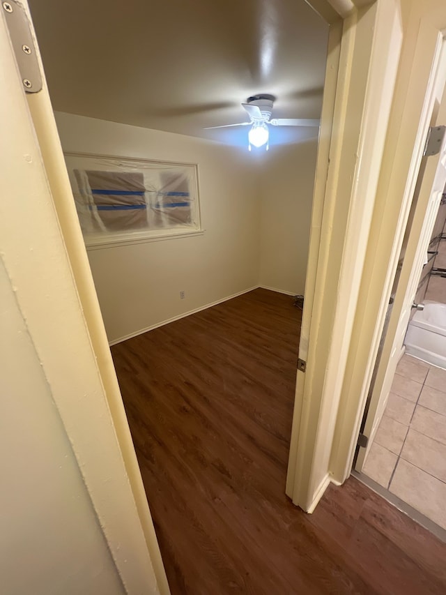 empty room featuring ceiling fan and wood finished floors