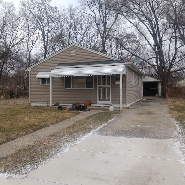 bungalow-style house featuring an outdoor structure