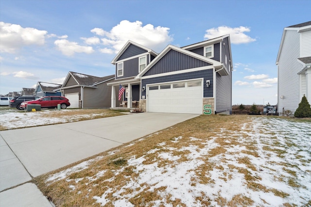 135 Barnsley Dr, Howell, MI 48843 - view of front facade with an attached garage, stone siding, board and batten siding, and concrete driveway