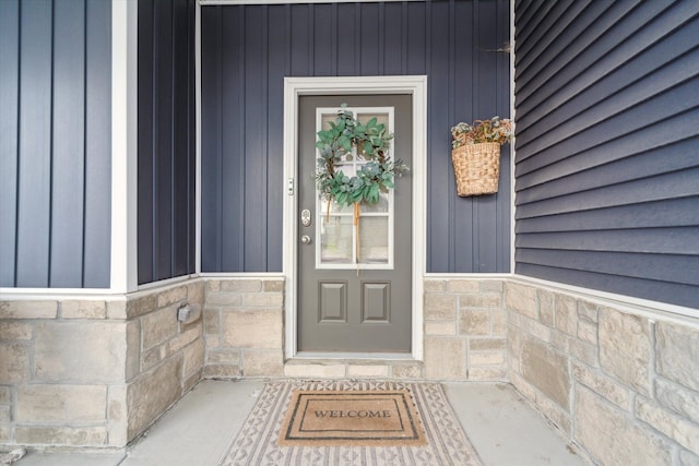 135 Barnsley Dr, Howell, MI 48843 - view of exterior entry featuring stone siding