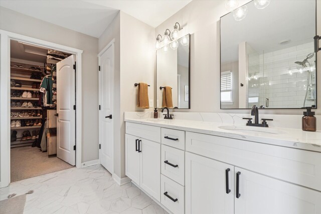 135 Barnsley Dr, Howell, MI 48843 - full bathroom featuring marble finish floor, double vanity, a sink, and a shower stall