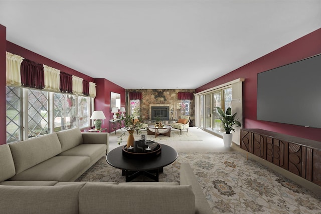 carpeted living room with a fireplace