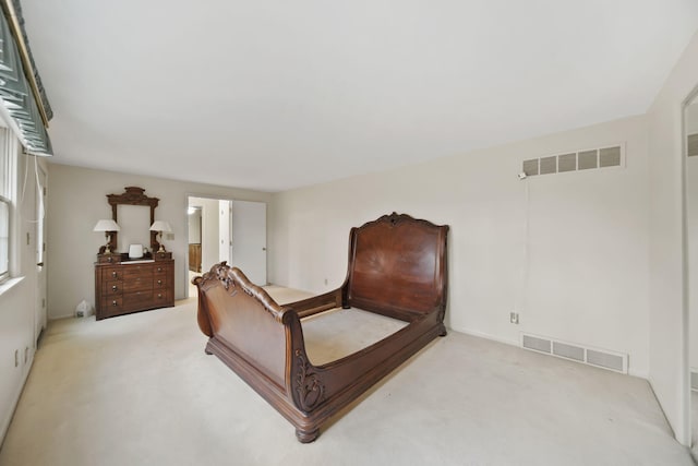 bedroom featuring carpet floors and visible vents