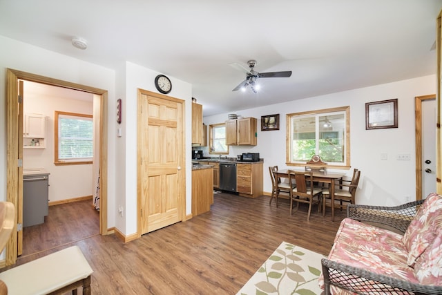 living room featuring ceiling fan, wood finished floors, and baseboards