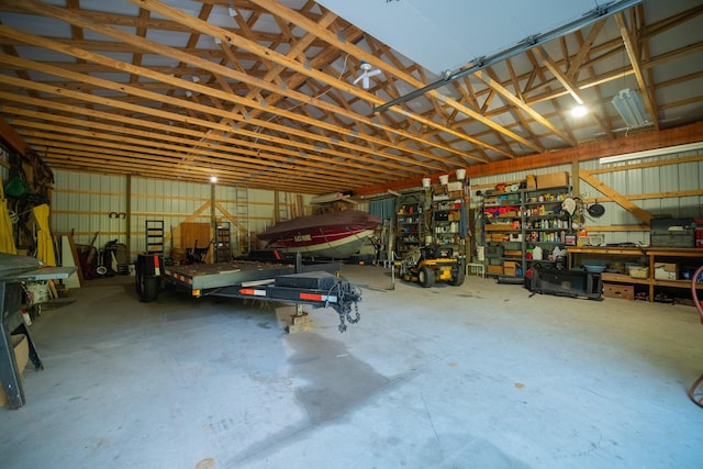 garage with a workshop area and metal wall