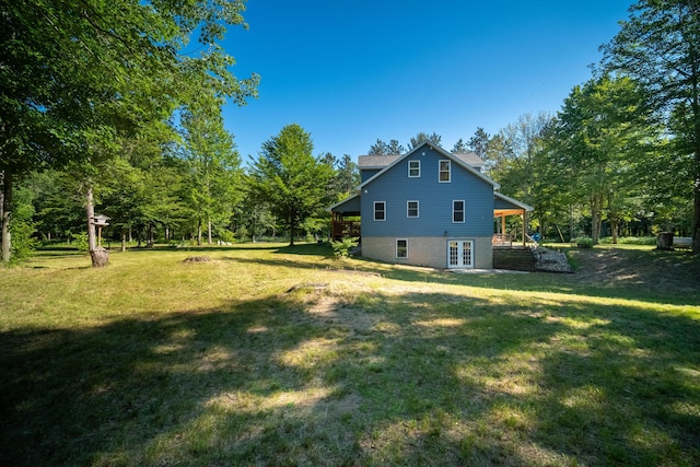 view of yard with french doors