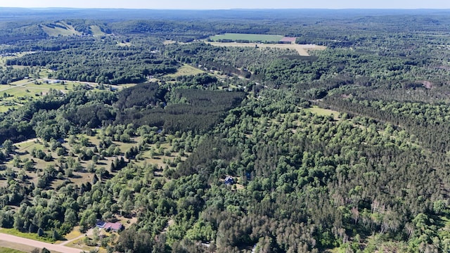 drone / aerial view with a view of trees