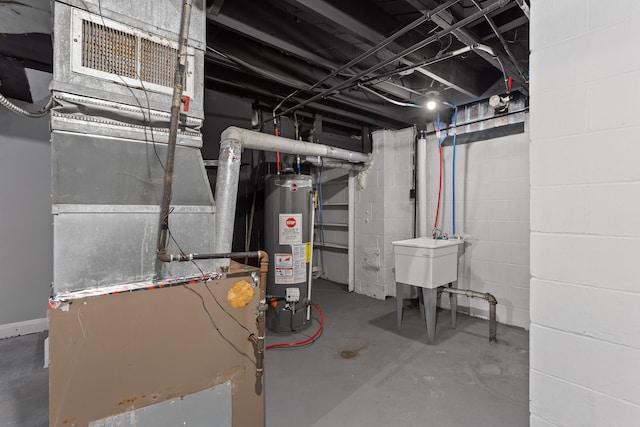 unfinished basement with heating unit, water heater, and a sink