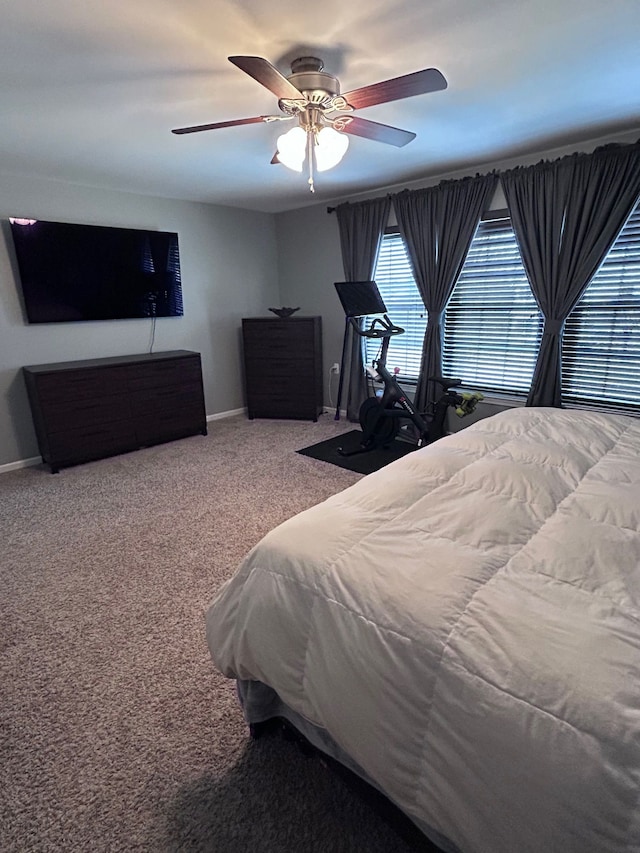 bedroom featuring carpet, ceiling fan, and baseboards