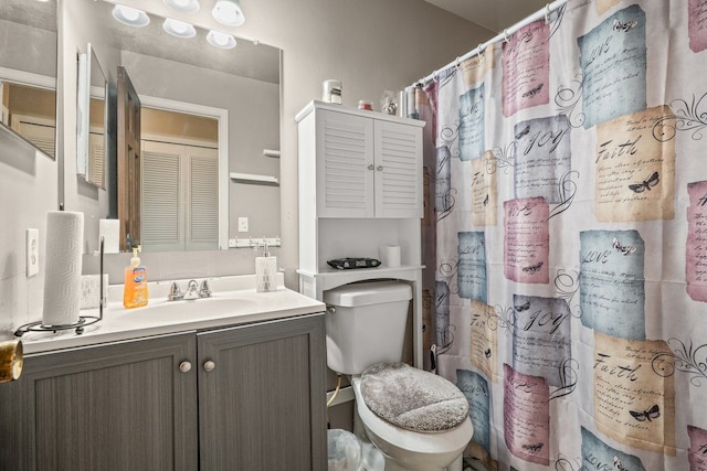 full bathroom with a shower with curtain, vanity, and toilet