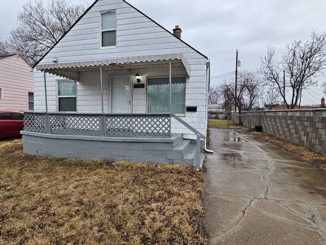 back of house with covered porch