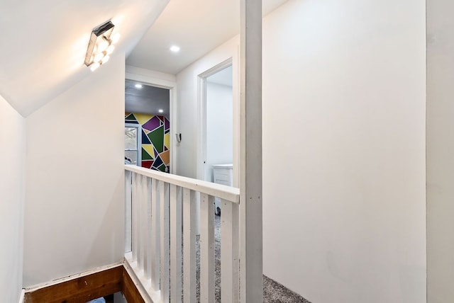 hallway featuring recessed lighting and vaulted ceiling