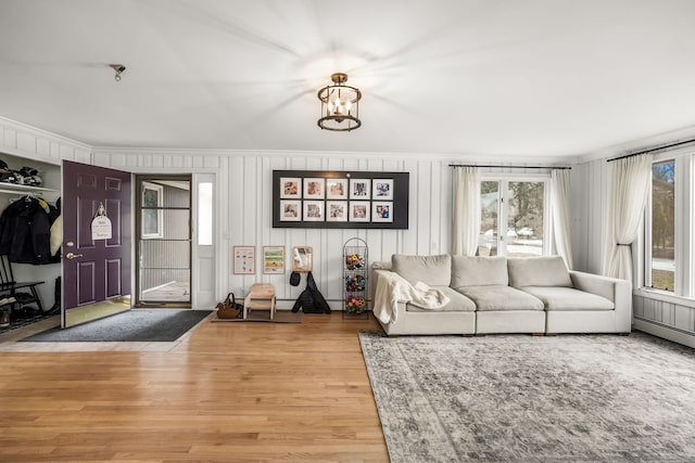 living room featuring an inviting chandelier and wood finished floors